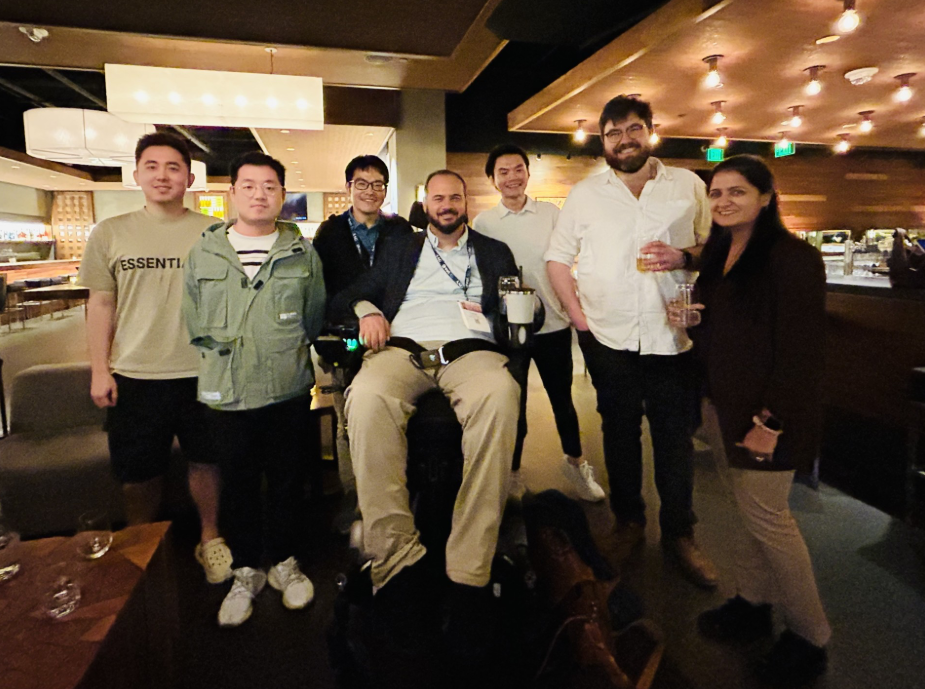 Faculty, students, alumni, and collaborators gathering during the SDSC AAG 2026 social event